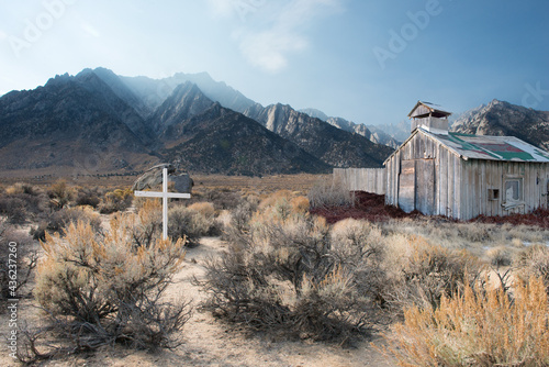 Cross next to an abandoned barn in the desert near Alabama Hills, Lone Pine, California, USA photo