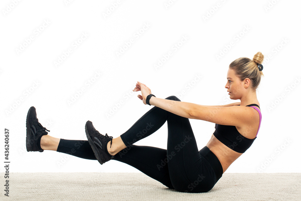 Young woman in sportswear train abs Young woman in sportswear train abs