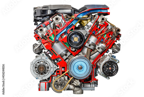 Cutaway of an internal combustion engine of a modern car at an exhibition stand, isolated on a white background. photo