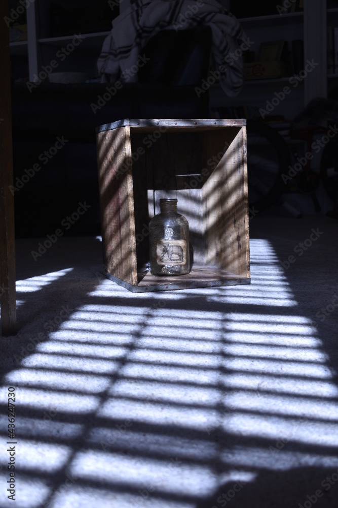 box with bottle still life, light and shadow