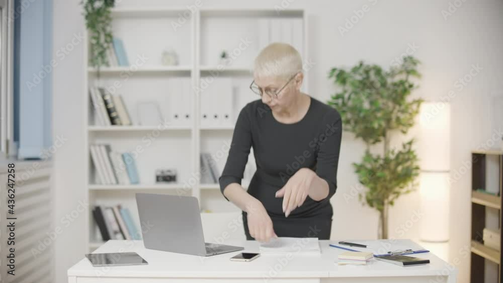 Tired businesswoman overworking in office, exhausted by paper work, stress Tired businesswoman overworking in office, exhausted by paper work, stress