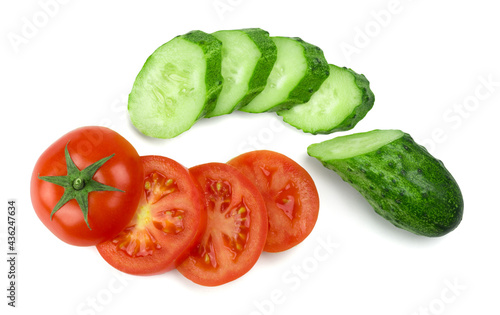 Ripe tomatoes and cucumbers sliced isolated on white background. Top view. Fresh vegetables food.