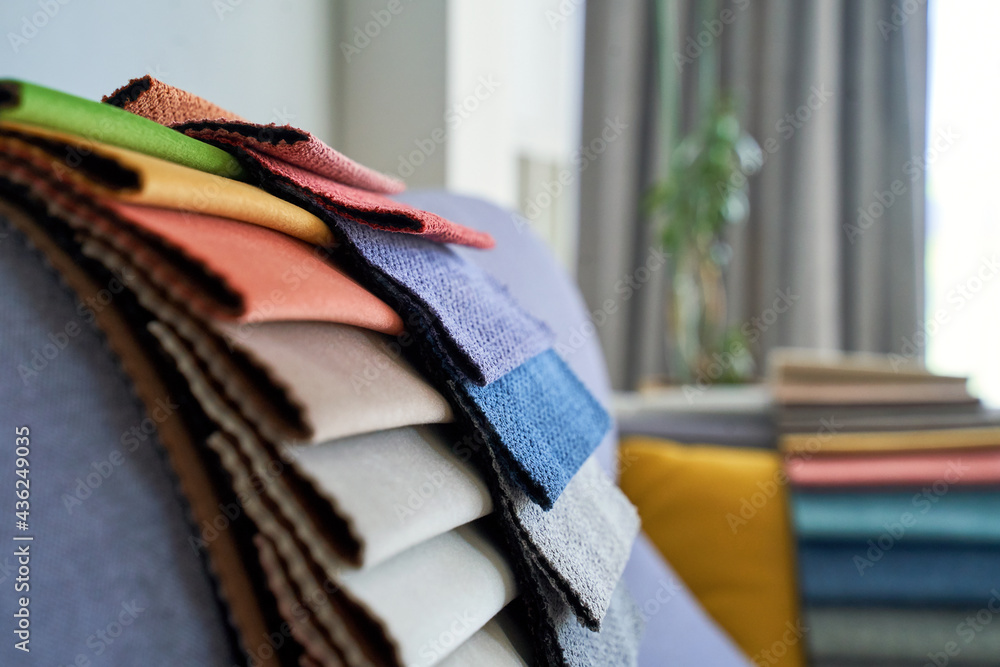 Colorful upholstery fabric samples on the sofa