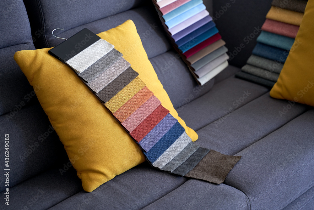 Colorful upholstery fabric samples on the sofa