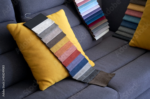 Obraz na płótnie Colorful upholstery fabric samples on the sofa w salonie