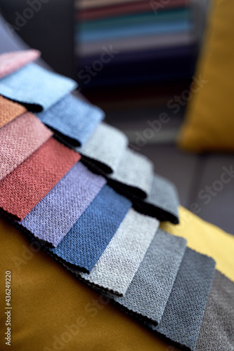 Colorful upholstery fabric samples on the sofa