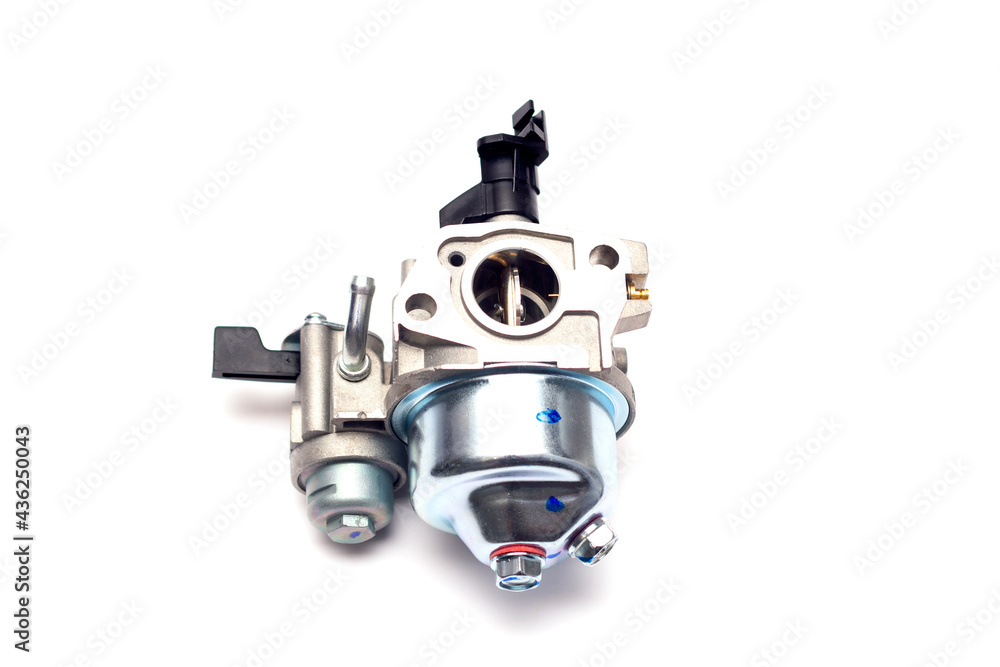 Cultivator carburetor on an isolated white background. New spare part. Cultivator carburetor on an isolated white background. New spare part.