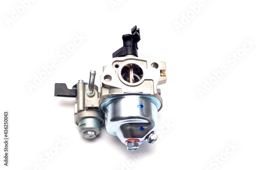 Cultivator carburetor on an isolated white background. New spare part. photo