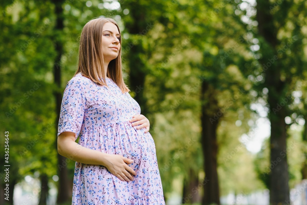 Pregnant woman resting in the park Pregnant woman resting in the park