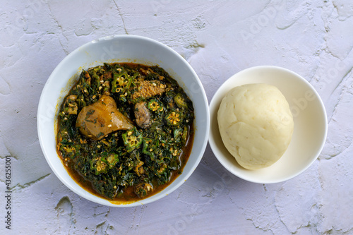 Okra soup served with fufu / pounded yam