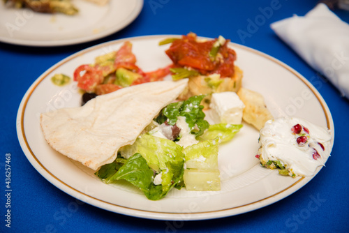 Greek salad with pita and dressing