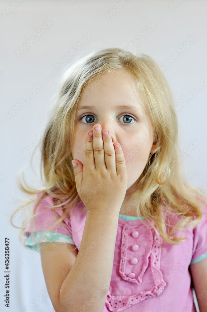 girl covering her mouth with her hand, child, emotions girl covering her mouth with her hand, child, emotions