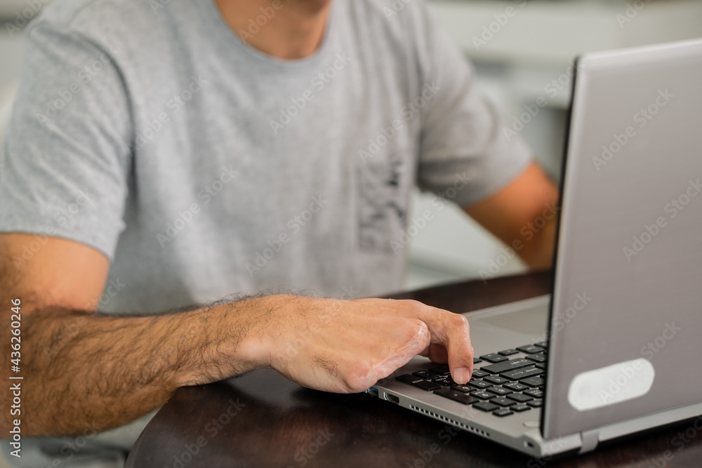 disabled man typing in laptop. disabled man typing in laptop.