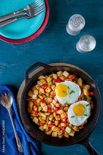 Potato hash and eggs in cast iron skillet