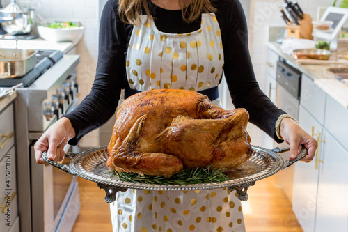Woman with Thanksgiving turkey  photo