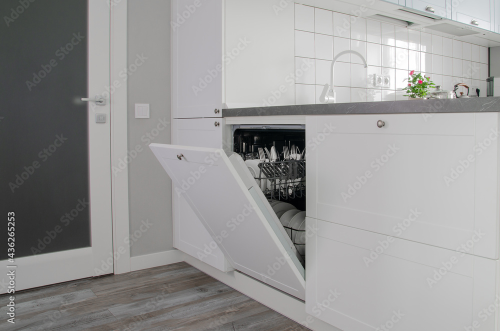 Open dishwasher with clean dishes after washing Open dishwasher with clean dishes after washing
