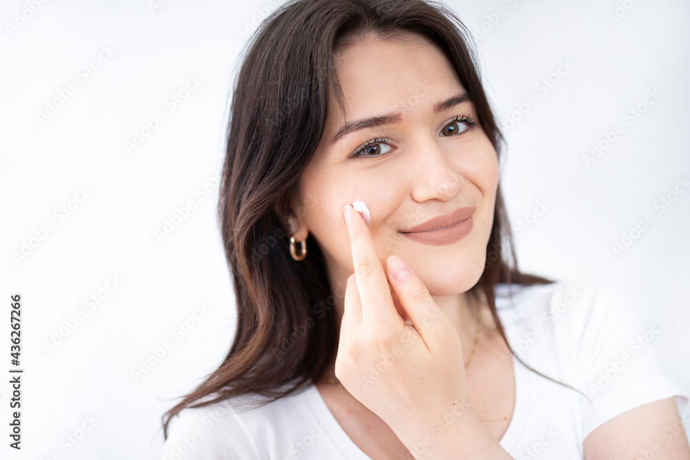 beautiful woman looking her skin at the mirror beautiful woman looking her skin at the mirror