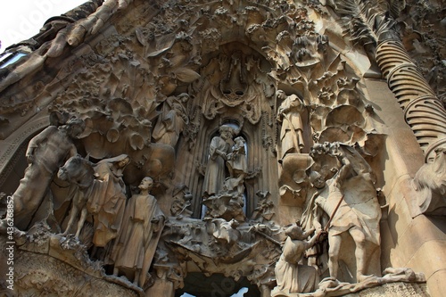 Carved statues on the exterior façade of Sagrada Familia cathedral in Barcelona in Spain