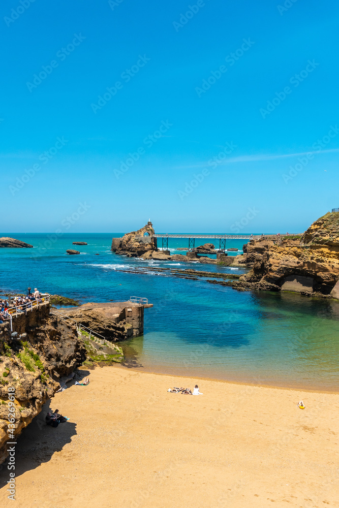 The beautiful Plage du Port Vieux on a summer afternoon where bathers can be seen bathing. Municipality of Biarritz, department of the Atlantic Pyrenees. France