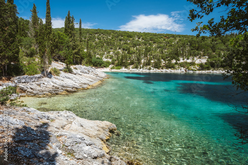 Fototapeta Naklejka Na Ścianę i Meble -  Beautiful Foki beach close to village of Fiskardo, is known for its emerald sea and cypress trees surrounding it. Ionian island Kefalonia, Greece.