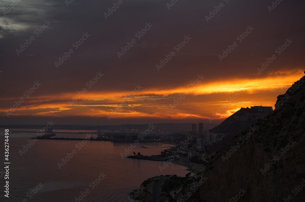 beautiful and colorful sunset in the city of Alicante, located in the Valencian Community, Spain