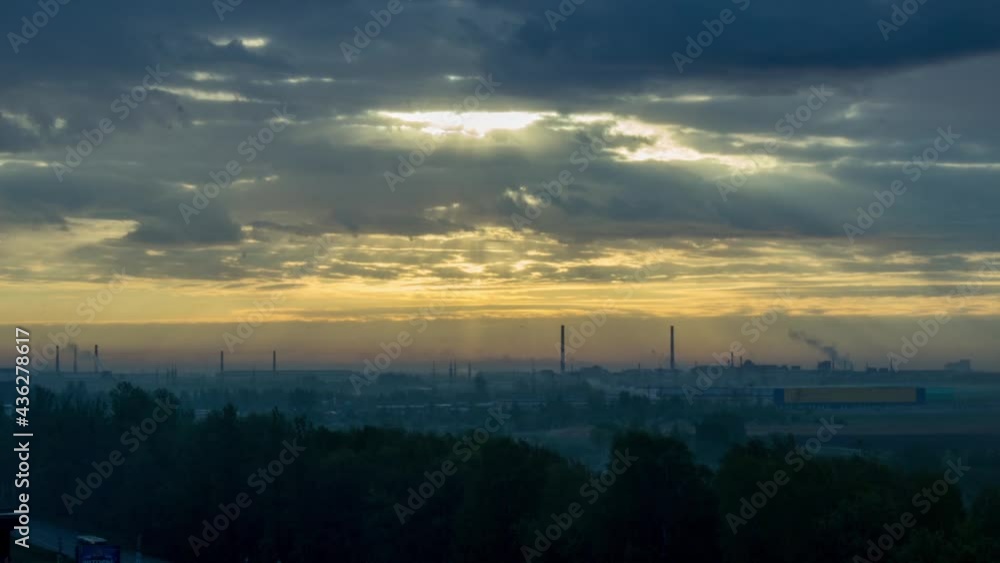 Wonderful sunrise on the outskirts. Sky. Rays. Fog. Smoke. Factory. Blue. Orange Wonderful sunrise on the outskirts. Sky. Rays. Fog. Smoke. Factory. Blue. Orange