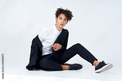 business man in a suit sitting on the floor self-confidence emotions