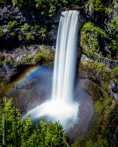 Rainbow at the base of Brandywine Falls at the Sea to Sky Highway between Squamish and Whistler  British Columbia  Canada
