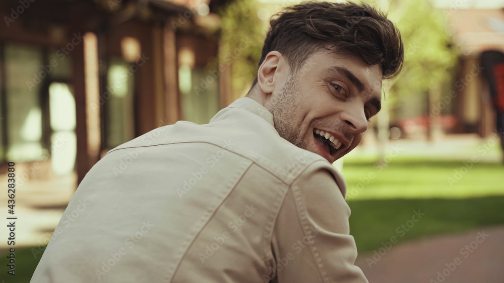happy man with open mouth smiling outside. happy man with open mouth smiling outside.