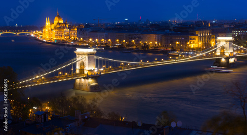 Night view on Patliament and Chain Bridge in hungarian city Budapest outdoors.