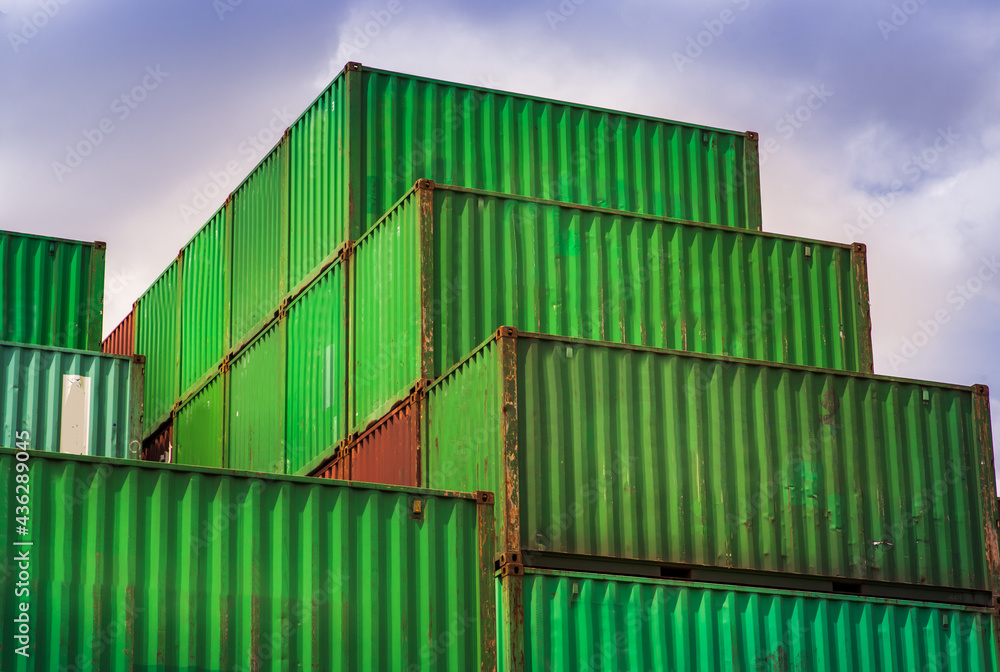 Industrial containers box for Logistic import export business concept. Stacked cargo containers in storage area. Industrial containers box for Logistic import export business concept. Stacked cargo containers in storage area.