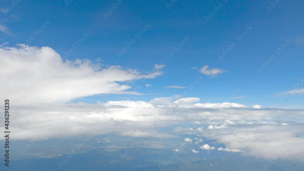 pure fresh blue sky and pollution free clear sky, soft white clouds taken from clear airplane window in sunny day about 20000 feet high. smooth fluffy clouds and plane wing flying in atmosphere. pure fresh blue sky and pollution free clear sky, soft white clouds taken from clear airplane window in sunny day about 20000 feet high. smooth fluffy clouds and plane wing flying in atmosphere.