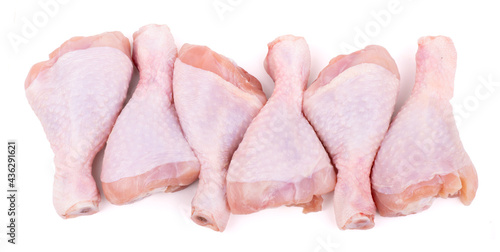 group of raw chicken drumsticks isolated on white background photo