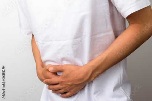A person feeling pain on a white background