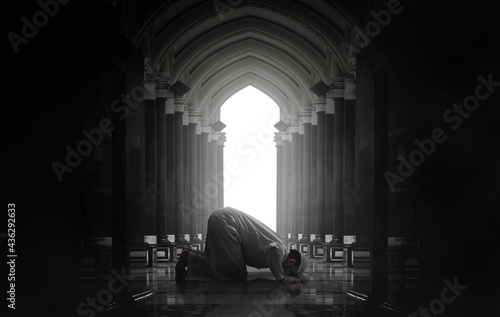 Religious asian muslim man praying photo