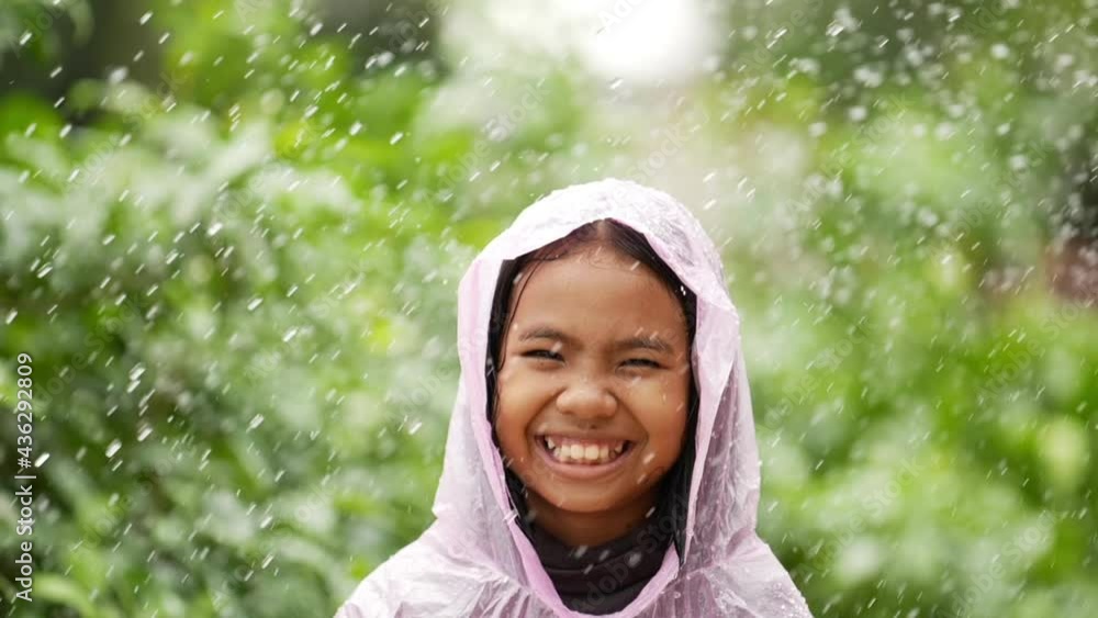 Happy girl wears raincoat Happy girl wears raincoat