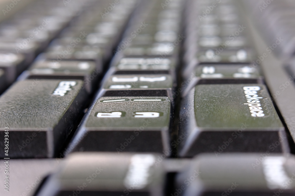 close up keyboard of a computer and macro keyboard with alphabets, computer button concept