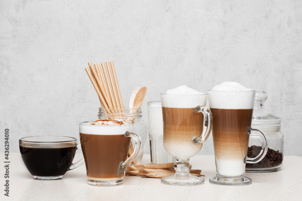 Coffee espresso, cappuccino, Latte macchiato with foam and milk in glasses  cups on a table. Coffee break Stock-Foto | Adobe Stock