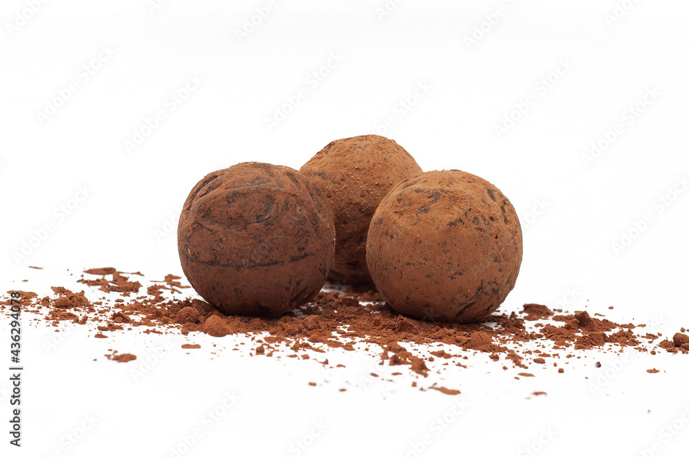 Chocolate truffles with cocoa powder isolated on a white background. Truffle chocolates candy Chocolate truffles with cocoa powder isolated on a white background. Truffle chocolates candy