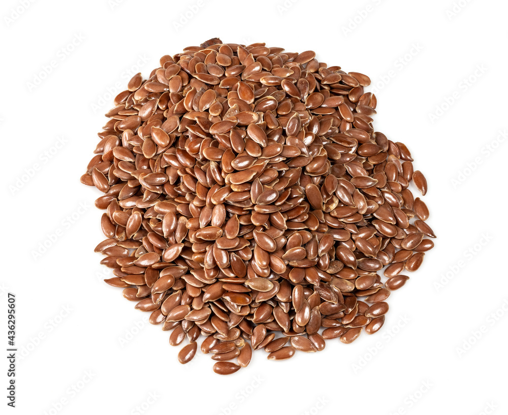 handful of brown flax seeds closeup on white handful of brown flax seeds closeup on white