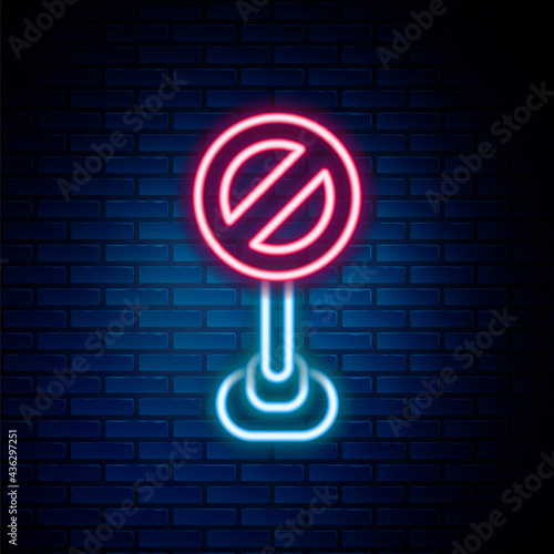 Glowing neon line Stop sign icon isolated on brick wall background. Traffic regulatory warning stop symbol. Colorful outline concept. Vector