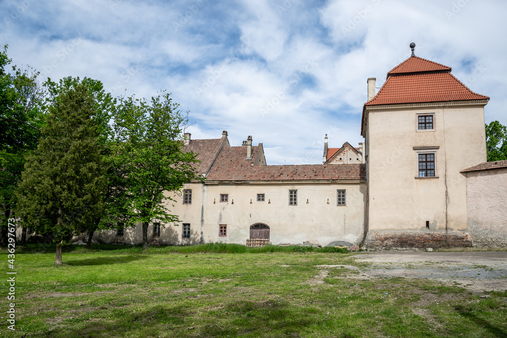 Zhovkva, Ukraine - 20.05.2021: The part of Zhovkva Castle, outdoor yard. It was founded by Polish Hetman Stanisław Żółkiewski as his fortified residence.