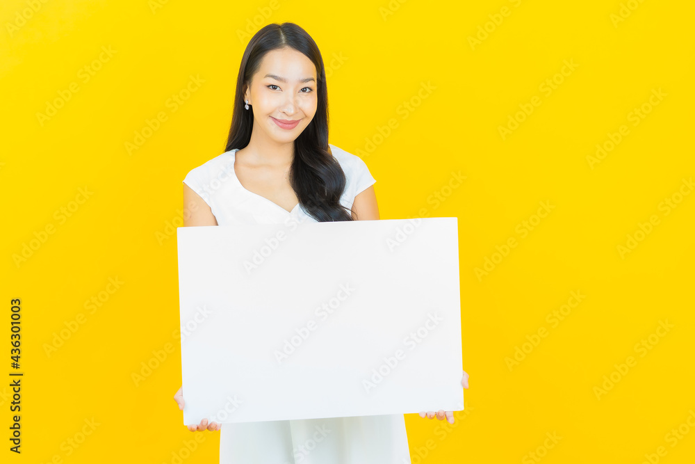 Portrait beautiful young asian woman with empty white billboard Portrait beautiful young asian woman with empty white billboard