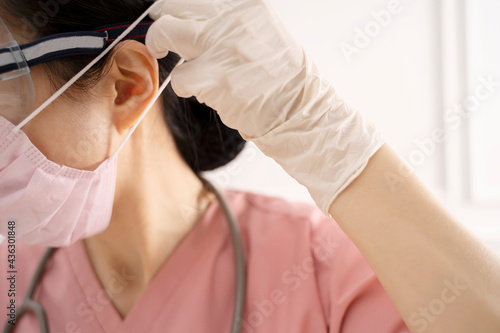 Close up of nurse wearing protective mask against coronavirus