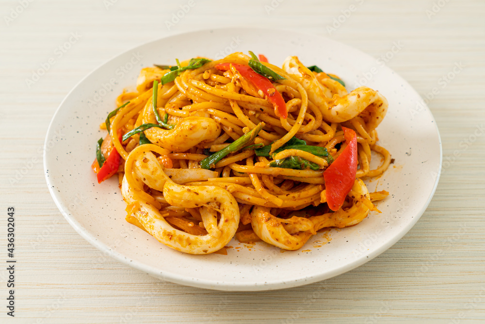 stir-fried spaghetti with salted egg and squid stir-fried spaghetti with salted egg and squid