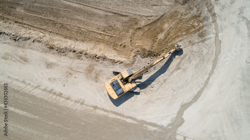 Top-down view of an excavator mining the earth