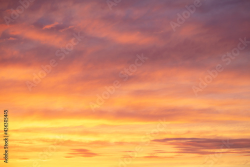 Colorful sunset with clouds in the sky. © schankz