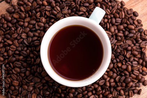Cup of coffee with Coffee beans, closeup