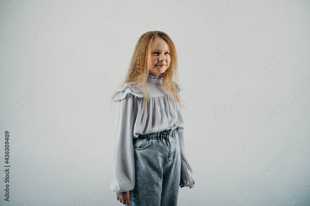 The half-breed girl smiles and looks into the camera. The half-breed girl smiles and looks into the camera.