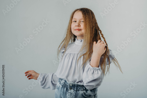 Fotografie The half-breed girl smiles and looks into the camera.